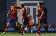 Spain's Cazorla and Alba run towards forward Mata after Mata scored against Ireland in the second half of their international friendly soccer match at Yankee Stadium in New York